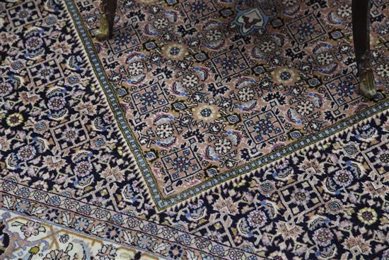 A modern Persian rug, 8ft by 5ft 7in.
